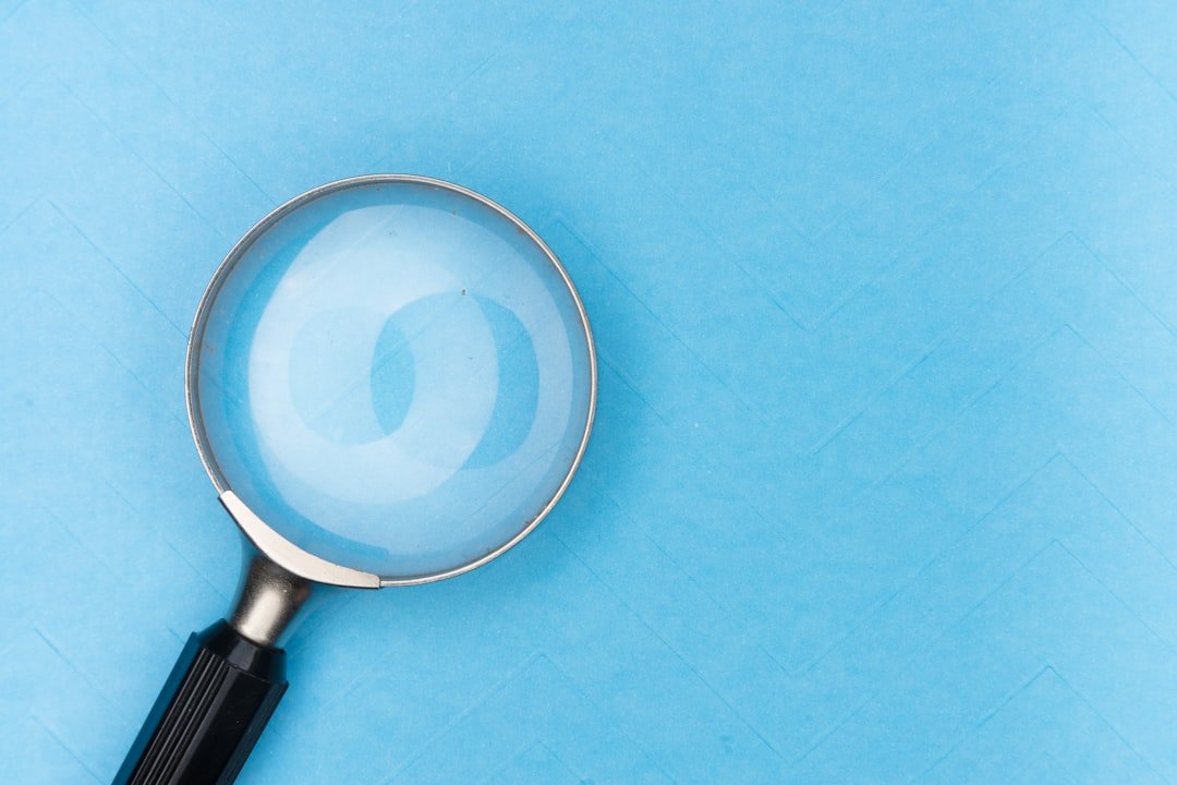 Magnifying glass on a white table representing research and search